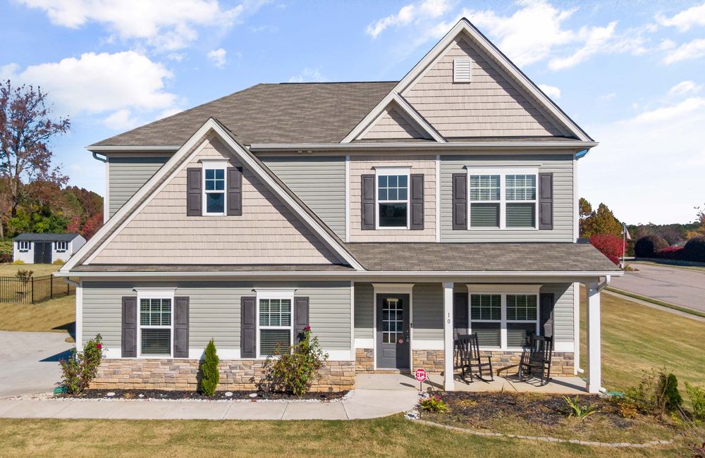 Two-story vinyl-sided home with a covered front porch in the Little Rock area