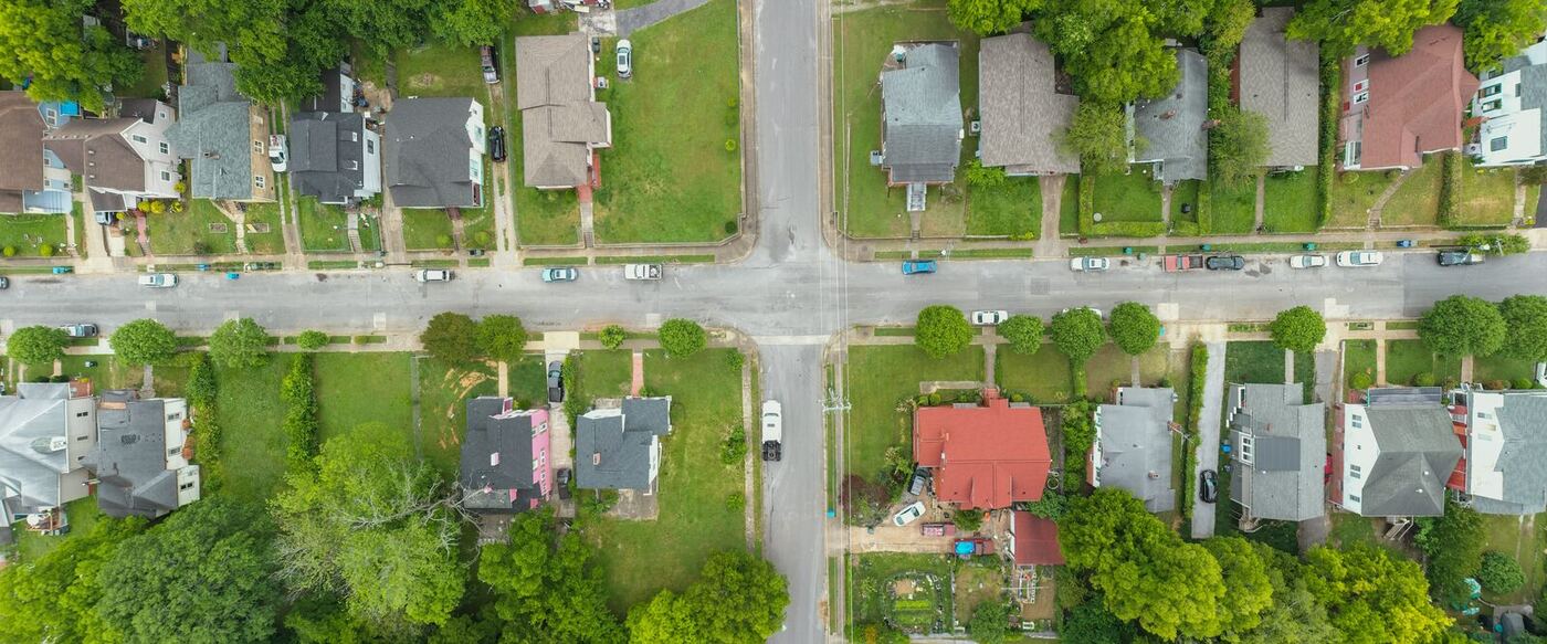 Aerial view of a residential neighborhood street typical of the Little Rock metro